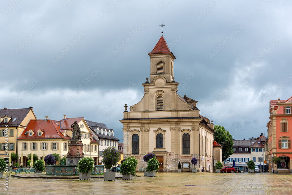 Catholic Church and Market Square (Marktplatz) in Ludwigsburg, Germany, cloudy sky in background.