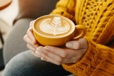 Relaxing Morning: Woman Enjoying Coffee on Sofa