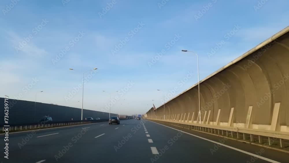 Protective screens along the freeway. Video shooting in motion, the effect of speed. Dust, wind, road noise insulation Protective screens along the freeway. Video shooting in motion, the effect of speed. Dust, wind, road noise insulation