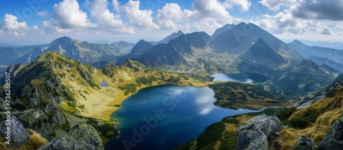 Tranquil Lake Amidst Majestic Mountain Peaks in a Picturesque Alpine Landscape