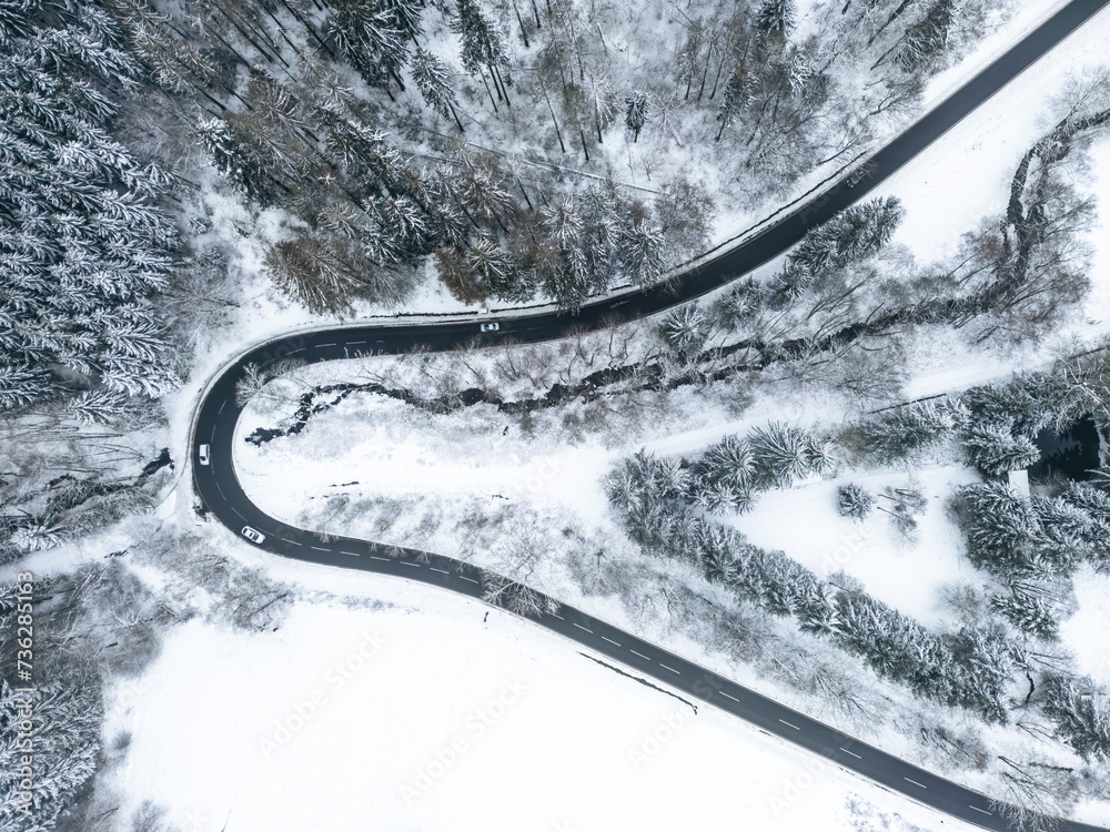 Top down view of a road making a U-Turn in the beautiful winter landscape Top down view of a road making a U-Turn in the beautiful winter landscape