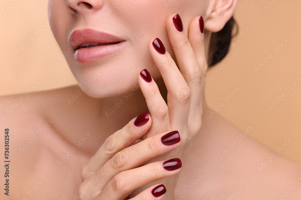 Woman with beautiful lips on beige background, closeup Woman with beautiful lips on beige background, closeup