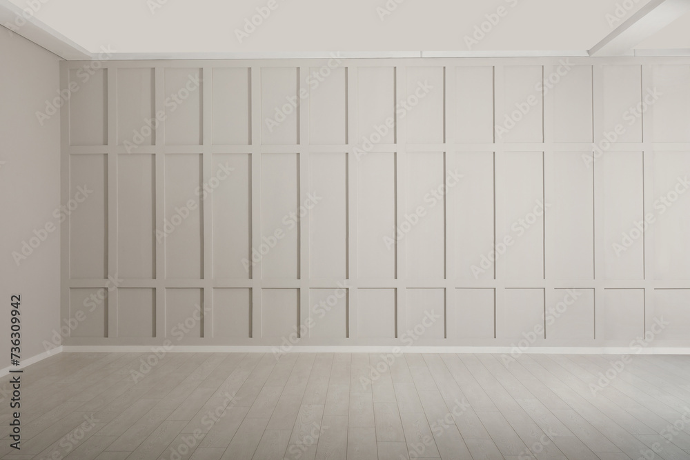 Empty room with beige walls and laminated flooring Empty room with beige walls and laminated flooring