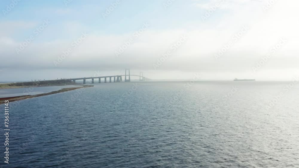 Calm Waters And The Hazy View Of Great Belt Bridge Calm Waters And The Hazy View Of Great Belt Bridge