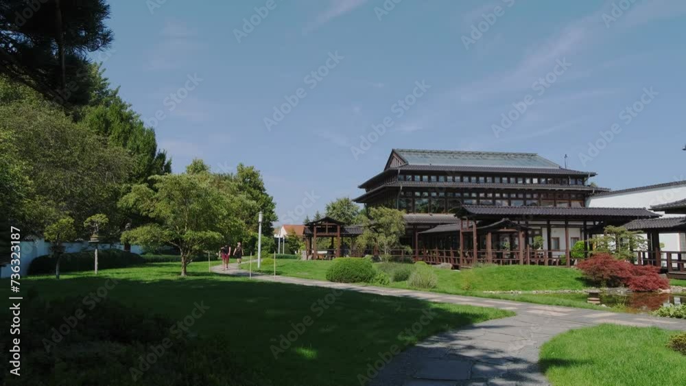 A beautiful Japanese-style landscape park in Bad Langensalza, Germany. Lake, wooden arbors, red bridge. A beautiful Japanese-style landscape park in Bad Langensalza, Germany. Lake, wooden arbors, red bridge.