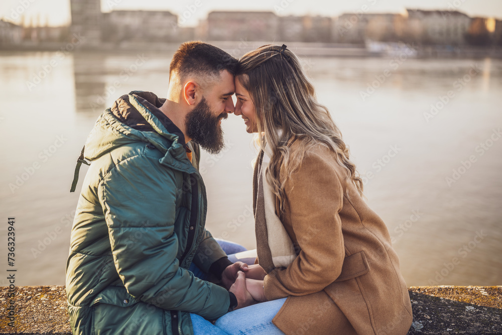 Fototapeta premium Happy couple holding hands while enjoy spending time together outdoor.