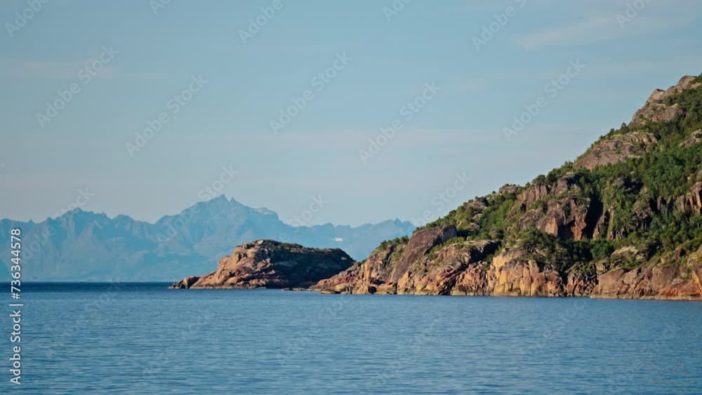 A Ferry's Scenic Passage With Rugged Mountains In View A Ferry's Scenic Passage With Rugged Mountains In View