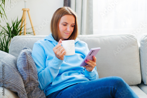 Woman Enjoying Morning Coffee and Smartphone
