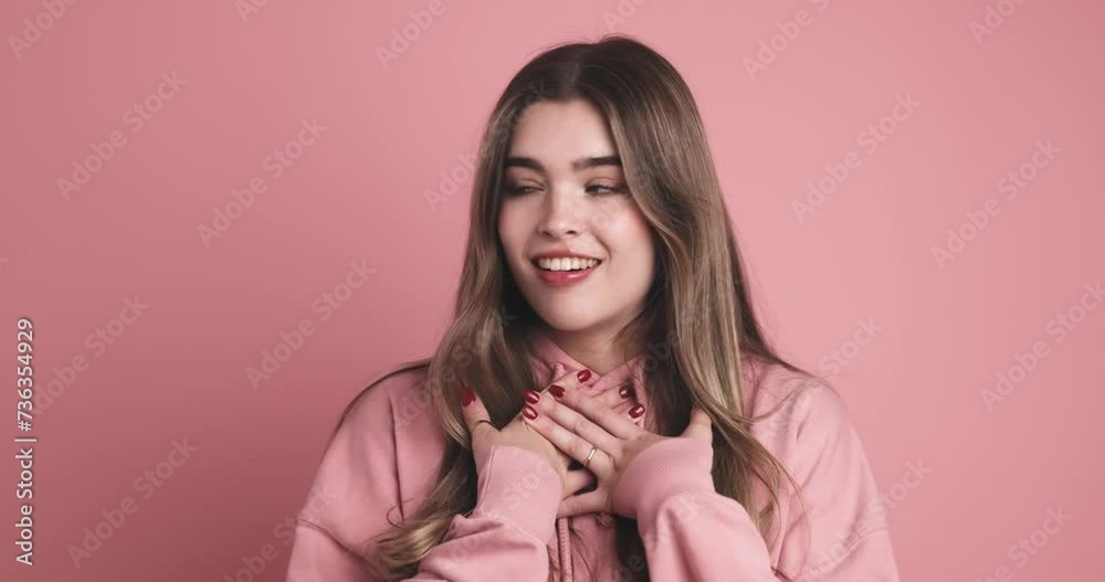 Cheerful thrilled young woman standing in room Cheerful thrilled young woman standing in room