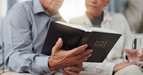 Canvas Print Couple, hands and home for reading bible, talking of faith and God with helping, support and scripture on sofa