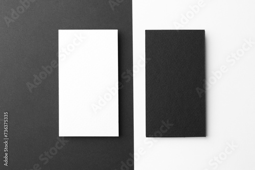 Blank business cards on color background, flat lay. Mockup for design