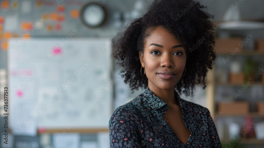 African American business woman making a project presentation, behind her you see a white board with written data. Women's day concept, empowerment. African American business woman making a project presentation, behind her you see a white board with written data. Women's day concept, empowerment.