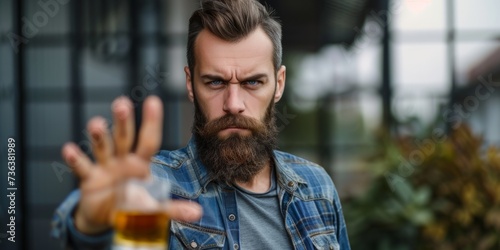 Man Rejects Whiskey, Demonstrating A Hand Gesture Of Refusal To Alcohol