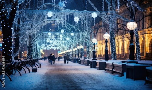 Nighttime Snowy Street Scene With People Walking