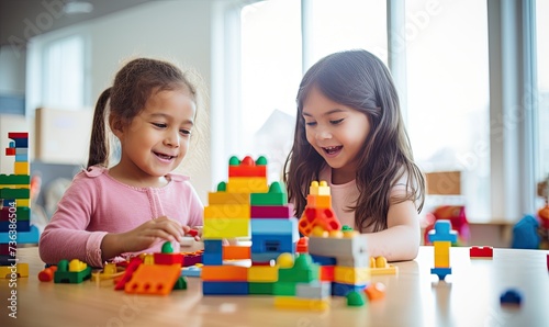 Two Young Girls Playing With Legos on a Table