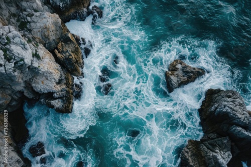 This photo shows a birds eye view of the expansive ocean with waves crashing against the rugged rocks along the coast, Aerial sight of the seaâ€™s foamy trail around clusters of rocks, AI Generated