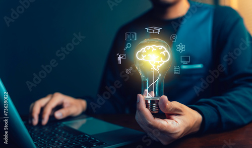 E-learning education, internet lessons and online webinar. Man holding lightbulb showing graduation hat, Internet education course degree study knowledge to creative thinking idea and problem solution