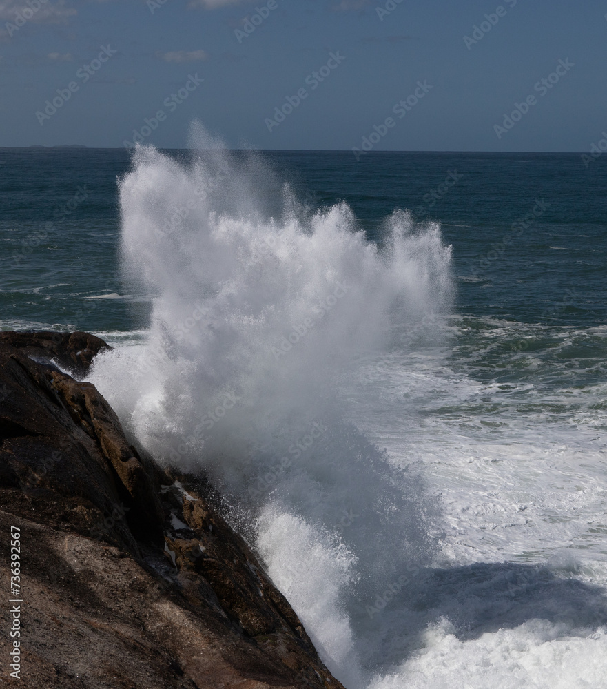 Big waves caused by the undertow crashing against the rocks at Rio de Janeiro, Brazil
