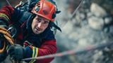 fearless fireman during an exercise carries the stretcher with the climbing rope 