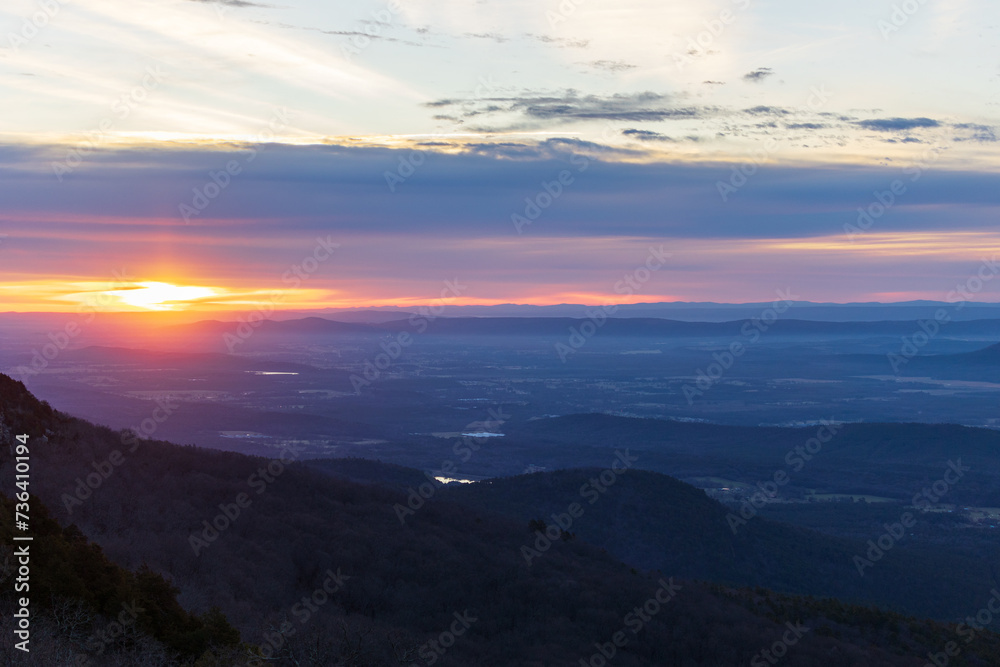 Sunrise from Mount Magazine Lodge overlooking Petit Jean River Valley.