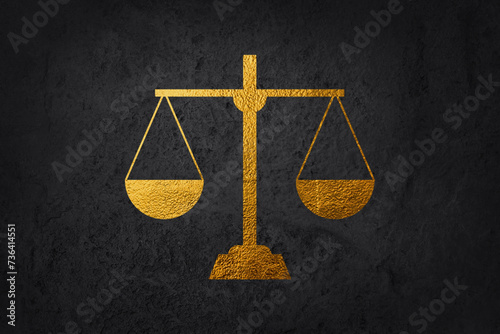 Gold brass balance scale isolated on black background. Sign of justice, lawyer. Gold Success concept. photo