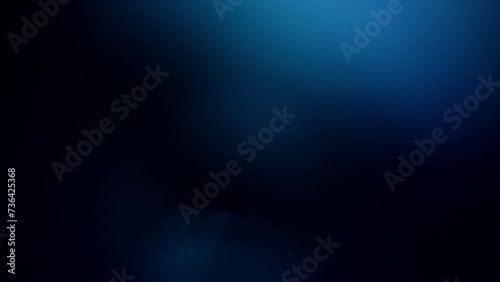 Defocused blue light reflections overlay on a black background