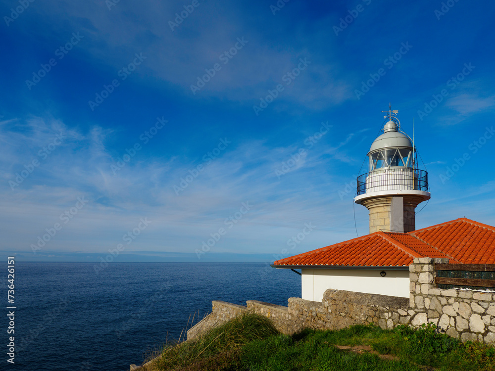 The lighthouse of Suances in Cantabria, Spain, photographed on a sunny day.