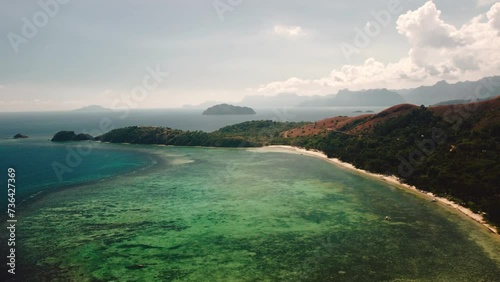 Aerial 4k view cinematic over Marcilla beach Coron, The Philippines. Beautiful scenic tropical beaches, mangroves, and turquoise waters photo