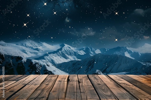 Empty wooden deck table against view of snowy mountain range in the night. With space for the product