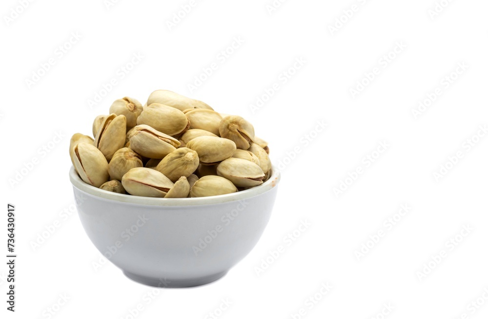 Pistachio Nut in a White Bowl Isolated on White Background with Copy Space in Horizontal Orientation Pistachio Nut in a White Bowl Isolated on White Background with Copy Space in Horizontal Orientation