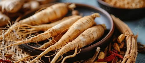 Red ginseng on dish with medicine for immunity and fatigue.