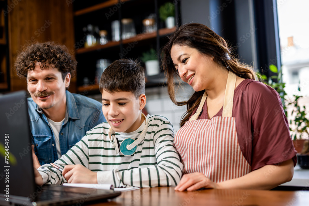 Latino boy doing his homework with the help of computer and his parents. Latino boy doing his homework with the help of computer and his parents.