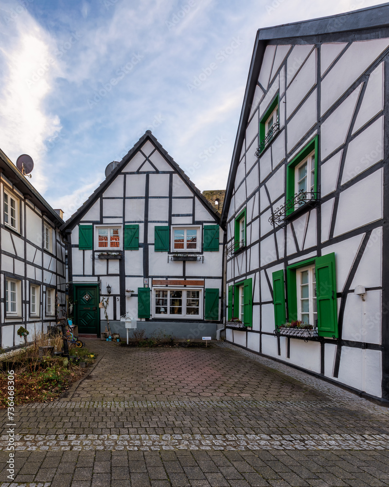 Fototapeta premium Typical medieval old town with half-timbered houses in Altesdorf Westerholt in Germany