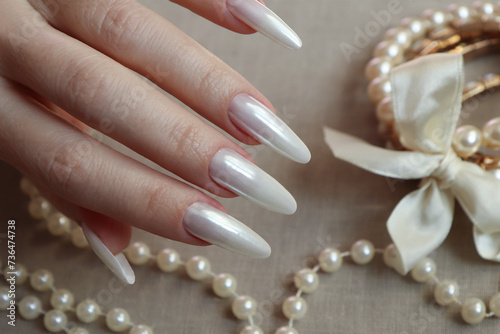 Long nails with a beautiful pearl coating.