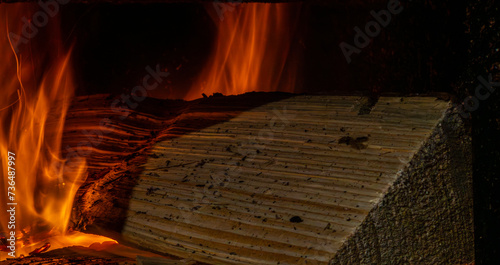 Obraz na płótnie Close-up of a log in the oven w salonie
