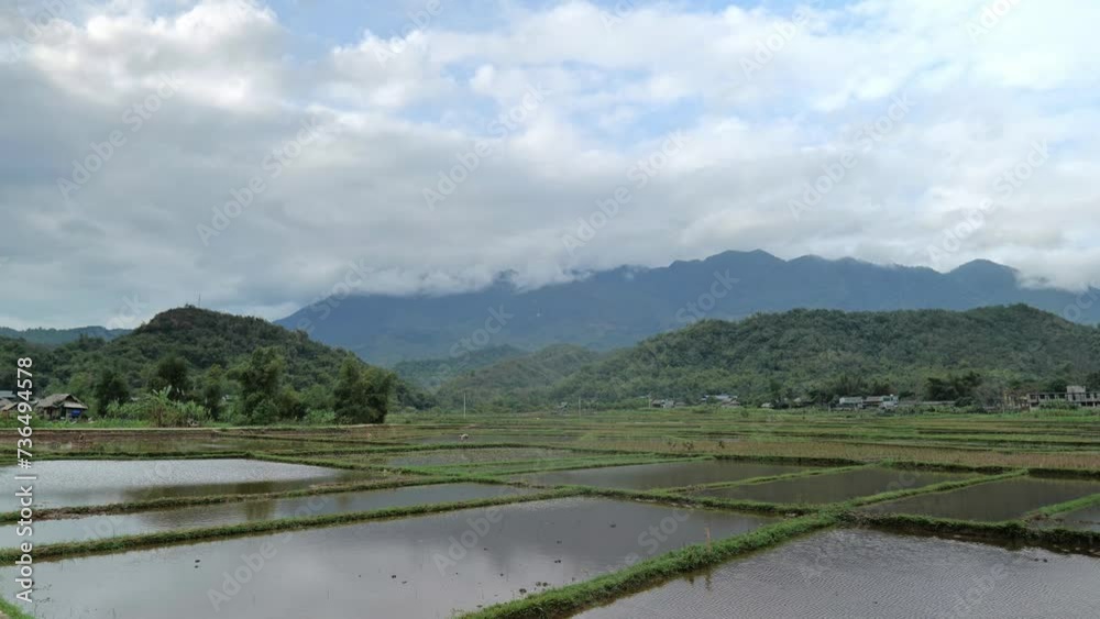 Mai Chau village landscape with rice paddy fields in North Vietnam. Mai Cau is a countryside are popular for tourists Mai Chau village landscape with rice paddy fields in North Vietnam. Mai Cau is a countryside are popular for tourists