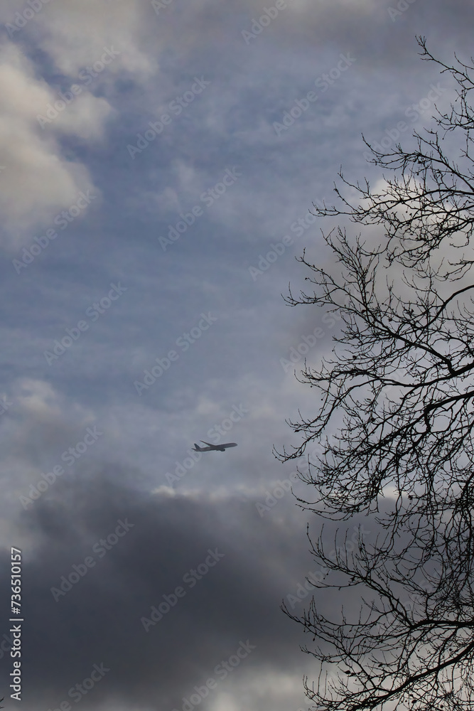 Silhouette of an airplane flying in the sky Silhouette of an airplane flying in the sky