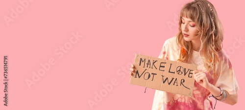 Female hippie holding placa...