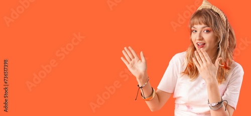 Female hippie on orange bac...