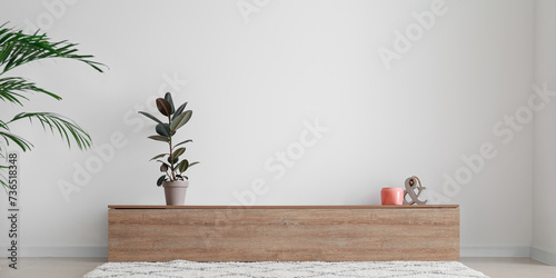 Interior of stylish room with modern TV stand near light wall