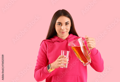 Young woman with glass and ...