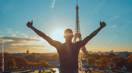African athlete representing athletics with arms wide open at the Paris Olympics games, with the Eiffel Tower in the background © Ignacio Carrera
