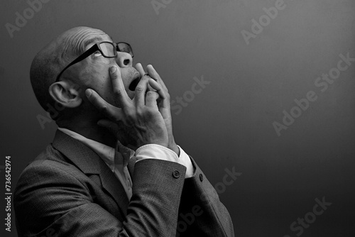 black man praying to god with black grey background with people stock image stock photo 