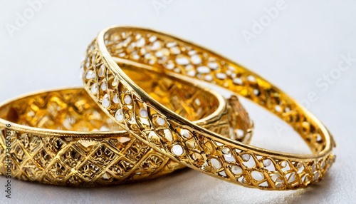 golden bangle bracelet isolated on the white background selective focus