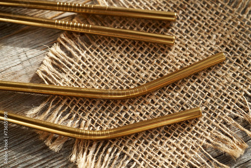 Ecological stainless steel straws on a table, close up