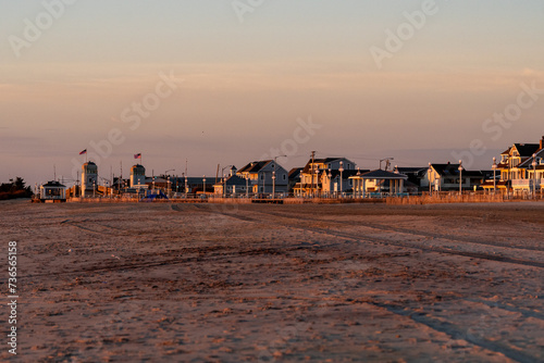 Avon By the Sea, New Jersey, USA - Golden hour from the beach looking at the homes on Ocean Ave and the Shark River Drawbridge 