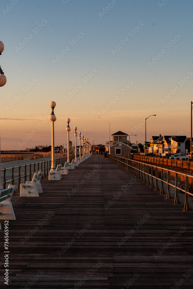 Avon By the Sea, New Jersey, USA - Golden hour sunrise on the boardwalk 