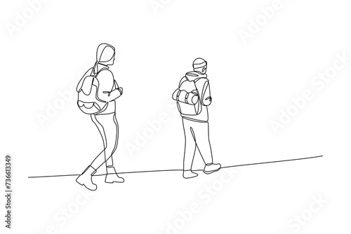 Continuous one line drawing couple man woman hikers with backpacks, binocular, and hiking gear reading route map. Looking for direction, trekking location. Single line draw design vector illustration
