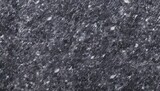 Dark grey granite stone texture with light dots