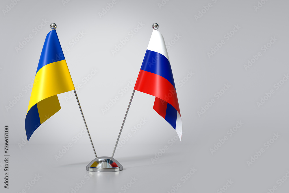 Ukrainian and Russian Flags on Table. 3d Rendering Ukrainian and Russian Flags on Table. 3d Rendering